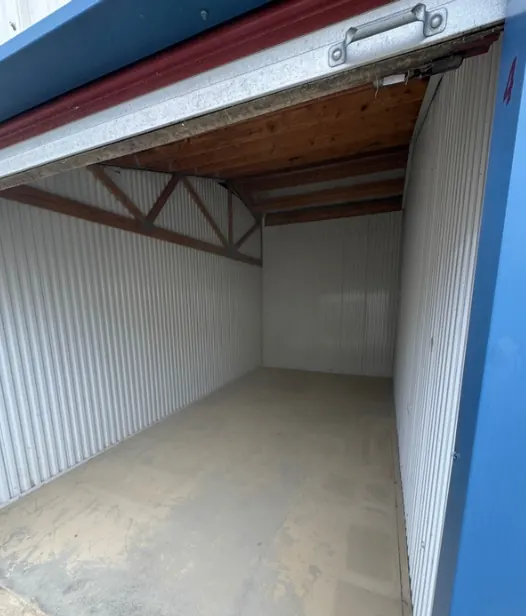 After: the same storage unit, completely empty.