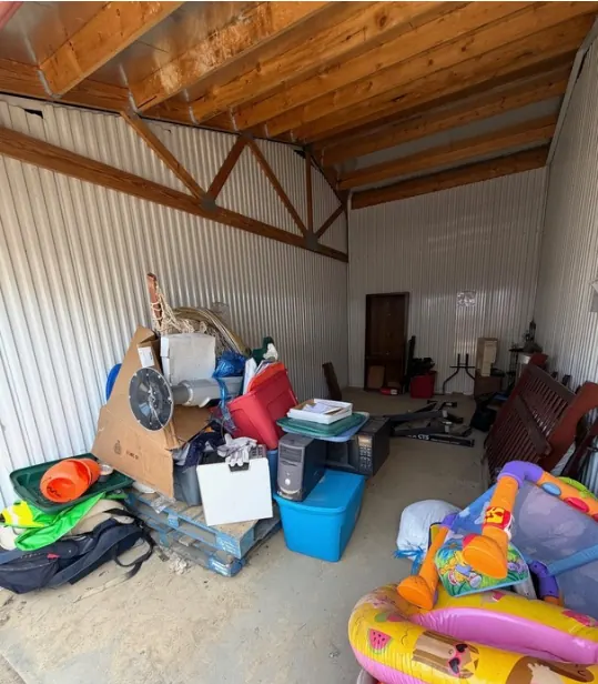 Before: a storage unit packed with totes, toys, electronics and furniture.